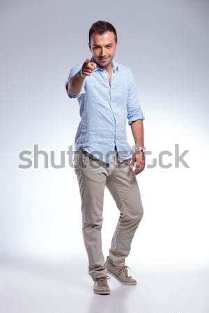 casual man takes off jacket and smiles Stock photo © feedough