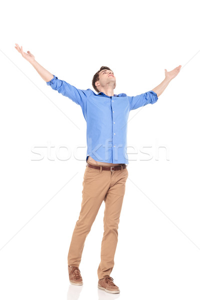  man holding both hands up celebrating. Stock photo © feedough