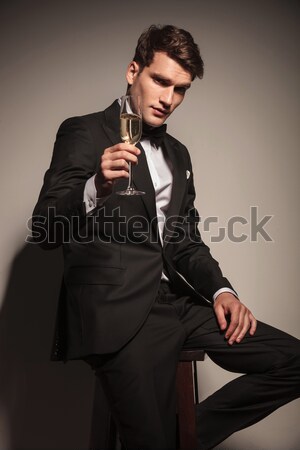 business man offering you a glass of champagne Stock photo © feedough