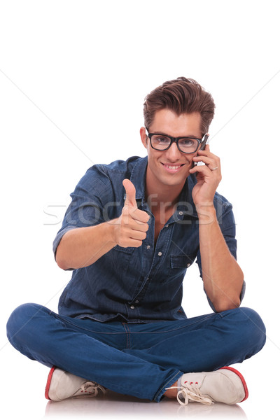 seated man on the phone ok sign Stock photo © feedough