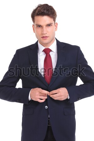 Young business man closing his jacket  Stock photo © feedough