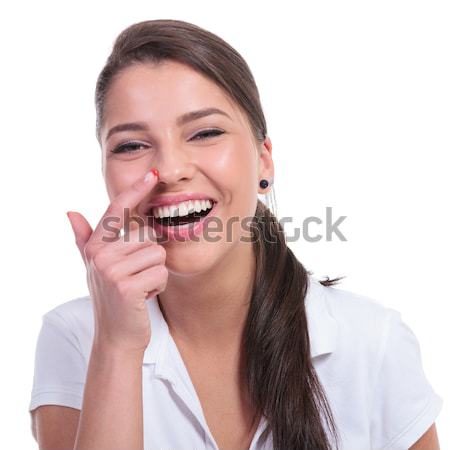 casual woman touches nose Stock photo © feedough