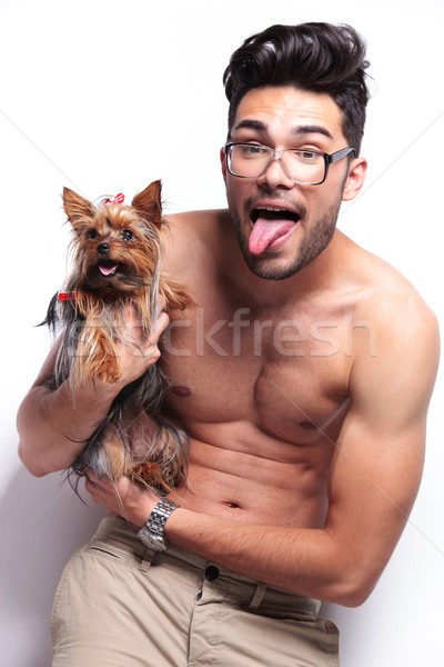 topless young man holding puppy and panting Stock photo © feedough
