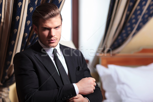 young business man fixes his cuffs Stock photo © feedough