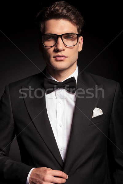 young elegant man closing his jacket Stock photo © feedough