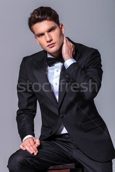 business man holding one hand to his neck  Stock photo © feedough