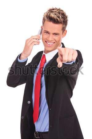 man pointing with finger while talking on the phone Stock photo © feedough