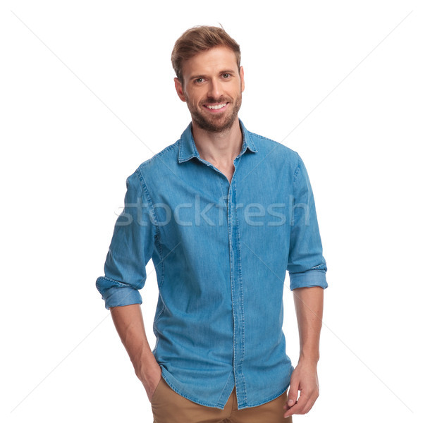 portrait of a smiling casual man with hand in pocket  Stock photo © feedough