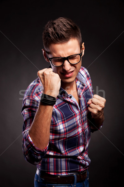 young man standing in fighting position with eyes closed Stock photo © feedough