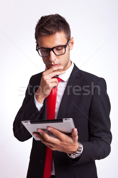 business man reaing news on his pad Stock photo © feedough