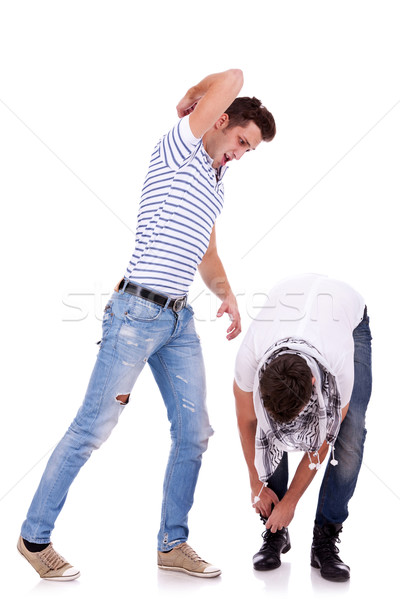 young man hits his friend with his elbow Stock photo © feedough