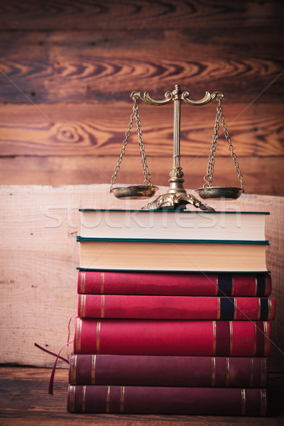 golden scale on top of stack of law books Stock photo © feedough