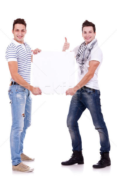 Foto stock: Dois · jovens · conselho · branco · papel