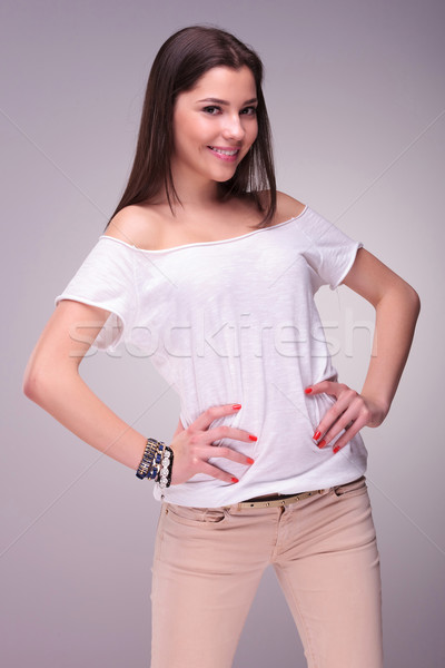 casual young woman with hands on hips Stock photo © feedough