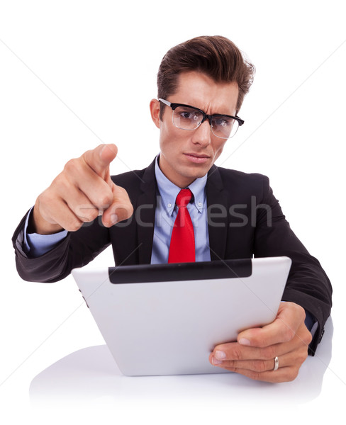 angry business man acusing while reading on his pad Stock photo © feedough