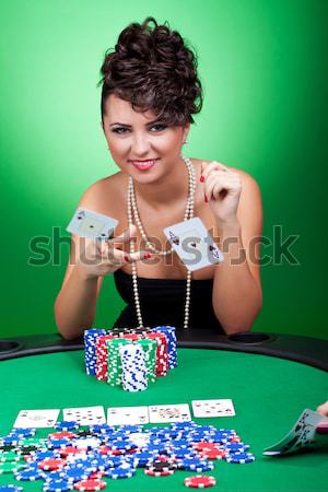 Stock photo: woman has four of a kind