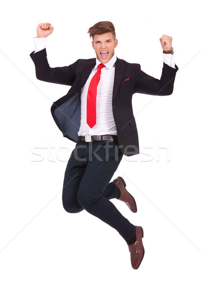 Om de afaceri jumping extatic tineri aer Imagine de stoc © feedough