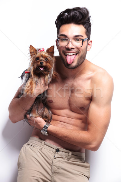 topless young man panting with puppy Stock photo © feedough
