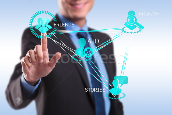 Stock photo: Business man pressing modern social buttons 