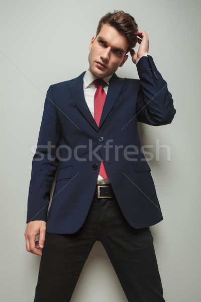 Handsome young business man scratching his head  Stock photo © feedough