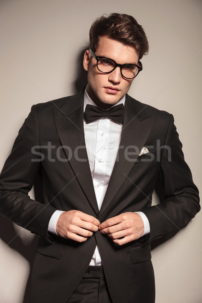 Young elegant business man closing his jacket  Stock photo © feedough