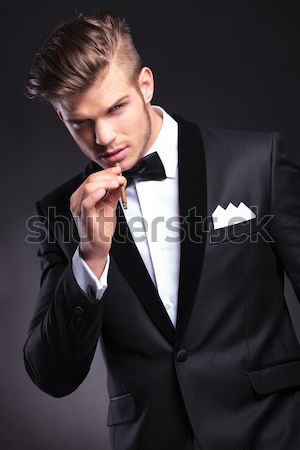 Stock photo: portrait of seductive businessman leaning to side while thinking