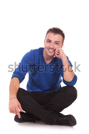 Człowiek skrzyżowanymi nogami uśmiechnięty młodych przypadkowy Zdjęcia stock © feedough