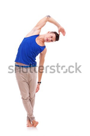 Mann Dehnung junger Mann blau Unterhemd stehen Stock foto © feedough