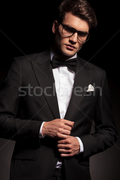 Handsome elegant man closing his jacket  Stock photo © feedough