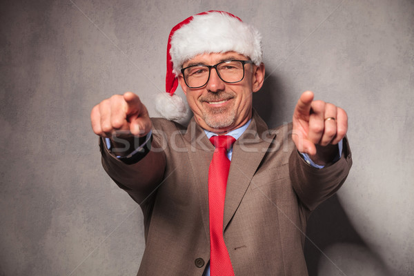 [[stock_photo]]: Homme · d'affaires · pointant · doigts · studio