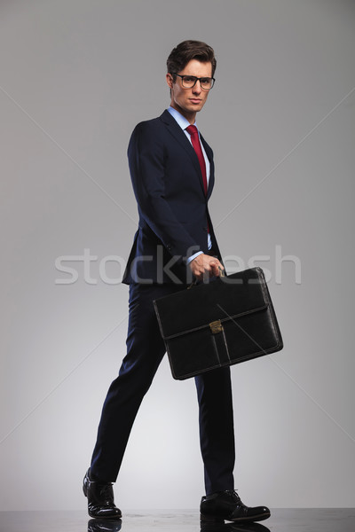 serious business holding a briefcase walks forward with confiden Stock photo © feedough