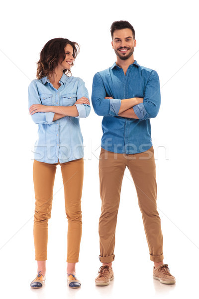 laughing casual woman with hands crossed looks at her boyfriend  Stock photo © feedough