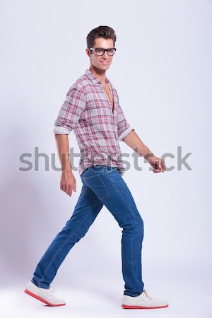 casual man stands with hands on hips Stock photo © feedough