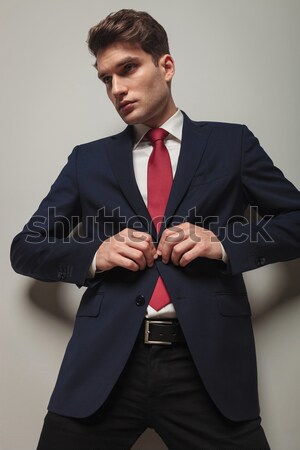 business man adjusting his jacket Stock photo © feedough