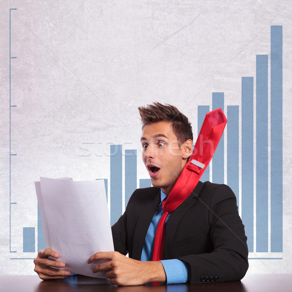 business man with flying tie reading the good news Stock photo © feedough