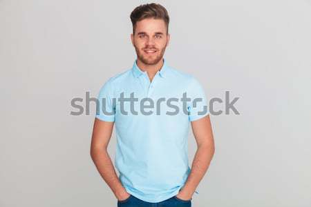 boy in polo shirt posing with hands in pockets Stock photo © feedough