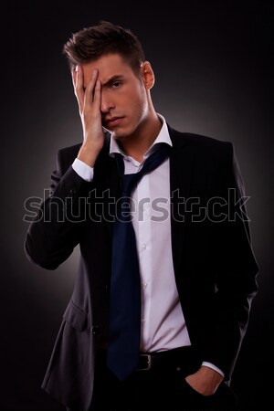 heartbroken groom in tuxedo with undone bowtie and open collar  Stock photo © feedough