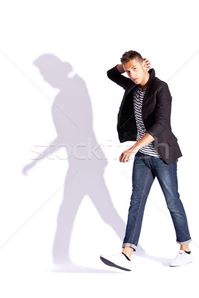 fashionable man walking and looking at the camera Stock photo © feedough