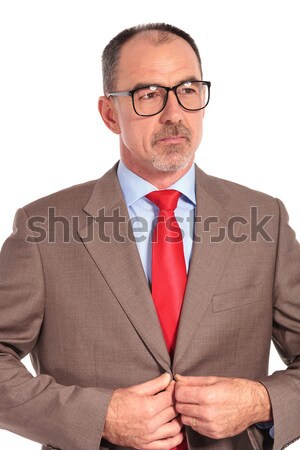 confident old businessman with glasses standing with hands cross Stock photo © feedough