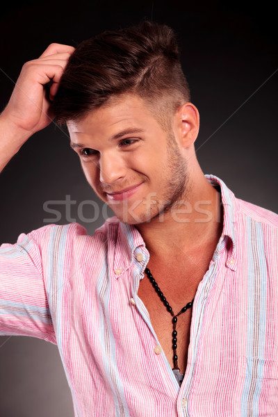 Stock photo: confused man scratching head