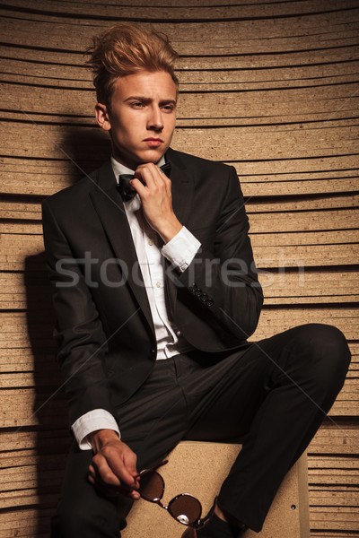 young business man fixing his bow tie  Stock photo © feedough