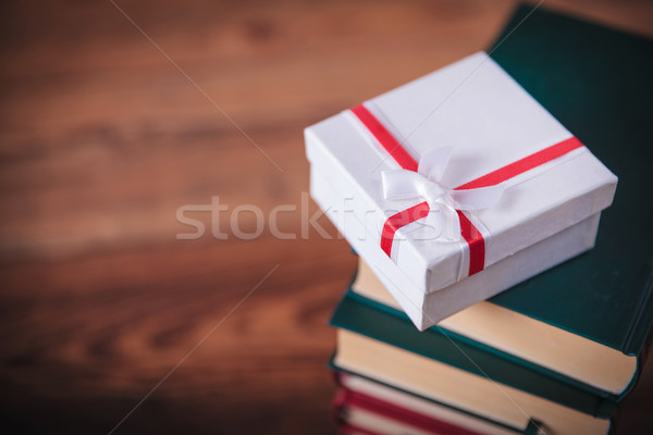 little present box on top  of books Stock photo © feedough