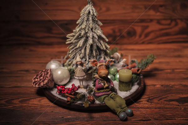 reindeer and little elf girl on a christmas arrangement Stock photo © feedough
