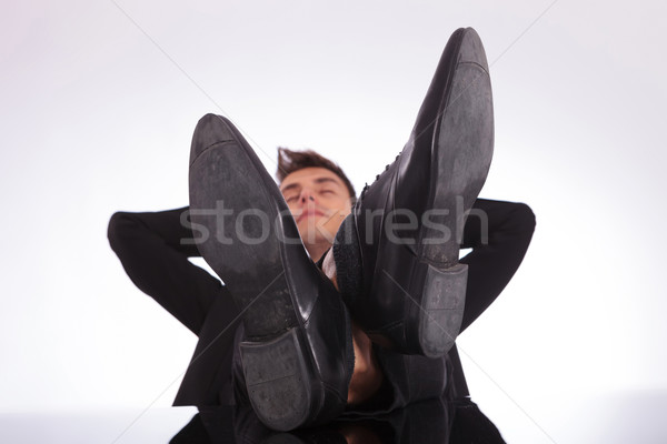 Nyugodt férfi lábak asztal fiatal üzletember Stock fotó © feedough