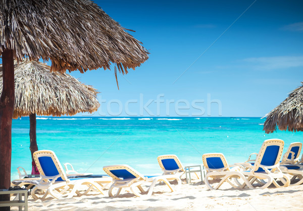 tropical view of a beach with umbrellas and  beach chairs Stock photo © feedough