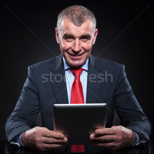 old business man working on his tablet pad computer Stock photo © feedough