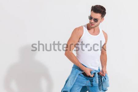 smiling man  standing with hands in his pockets  Stock photo © feedough