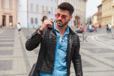 portrait of smiling young man with sunglasses on the street Stock photo © feedough