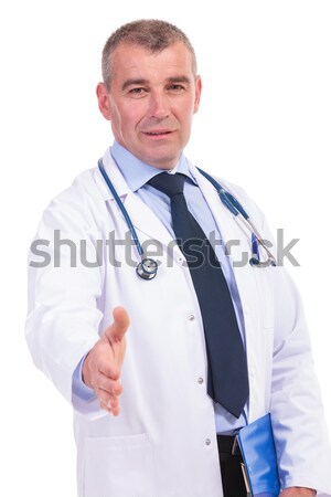 old doctor giving you a handshake Stock photo © feedough
