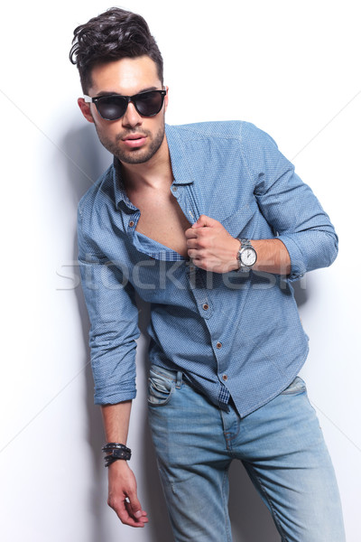 Stock photo: casual man with hand on shirt